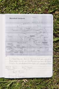 A student's personal map of the Marshall Islands, with their family tree.